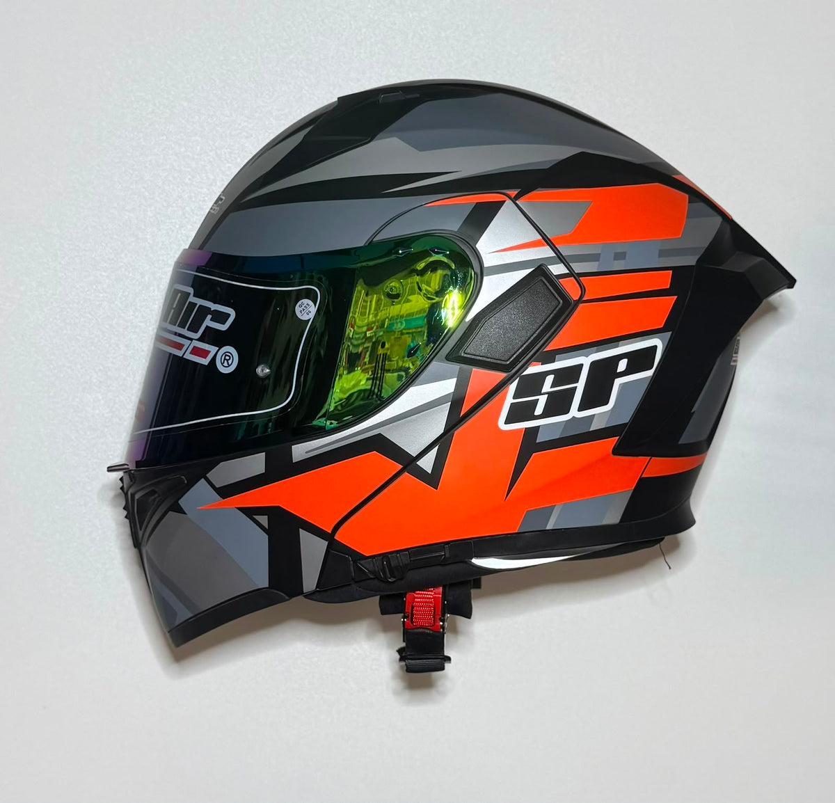 Super Air SP-918 Pro Orange helmet side view with green iridium visor closed showing SP branding