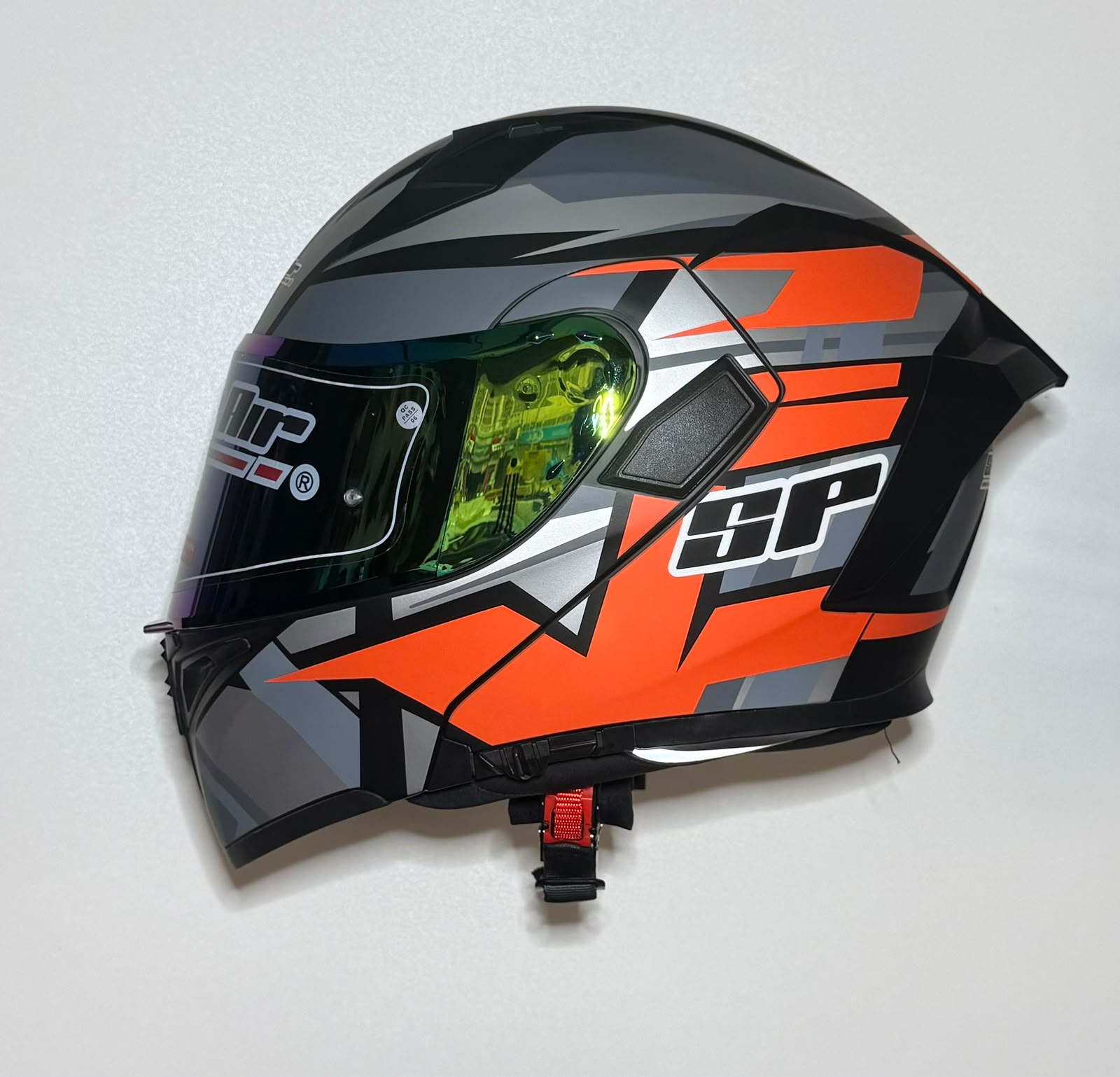 Super Air SP-918 Pro Orange helmet side view with green iridium visor closed showing SP branding